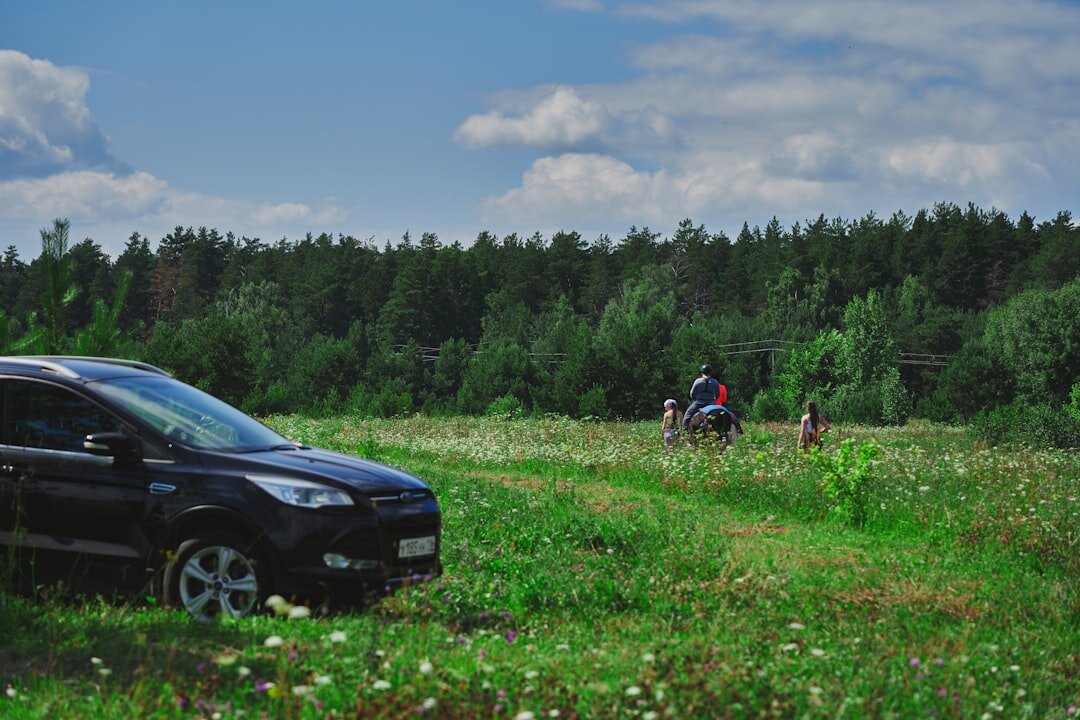 Seniors on a group sightseeing trip enjoying nature and a castle in the Slovak countryside