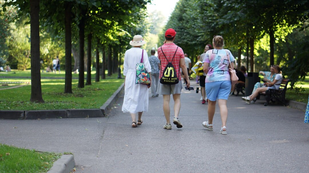 elderly people walking in park