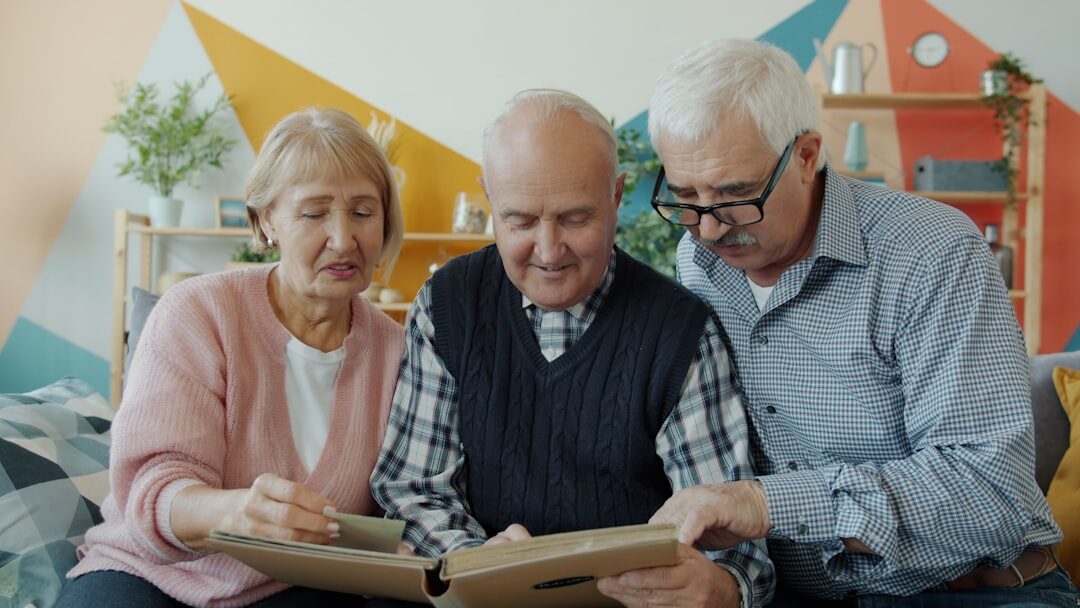 Seniors sitting together reviewing a printed events calendar and planner