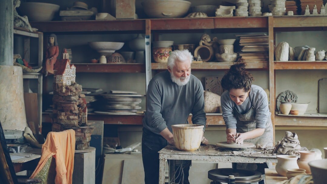 Seniors participating in a creative handicraft workshop at a table